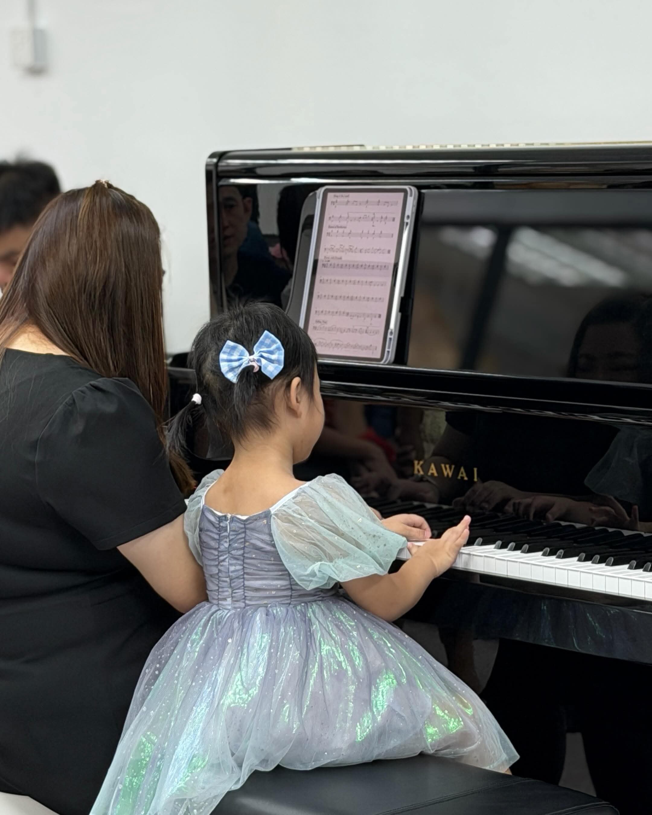 Young student performing at the piano
