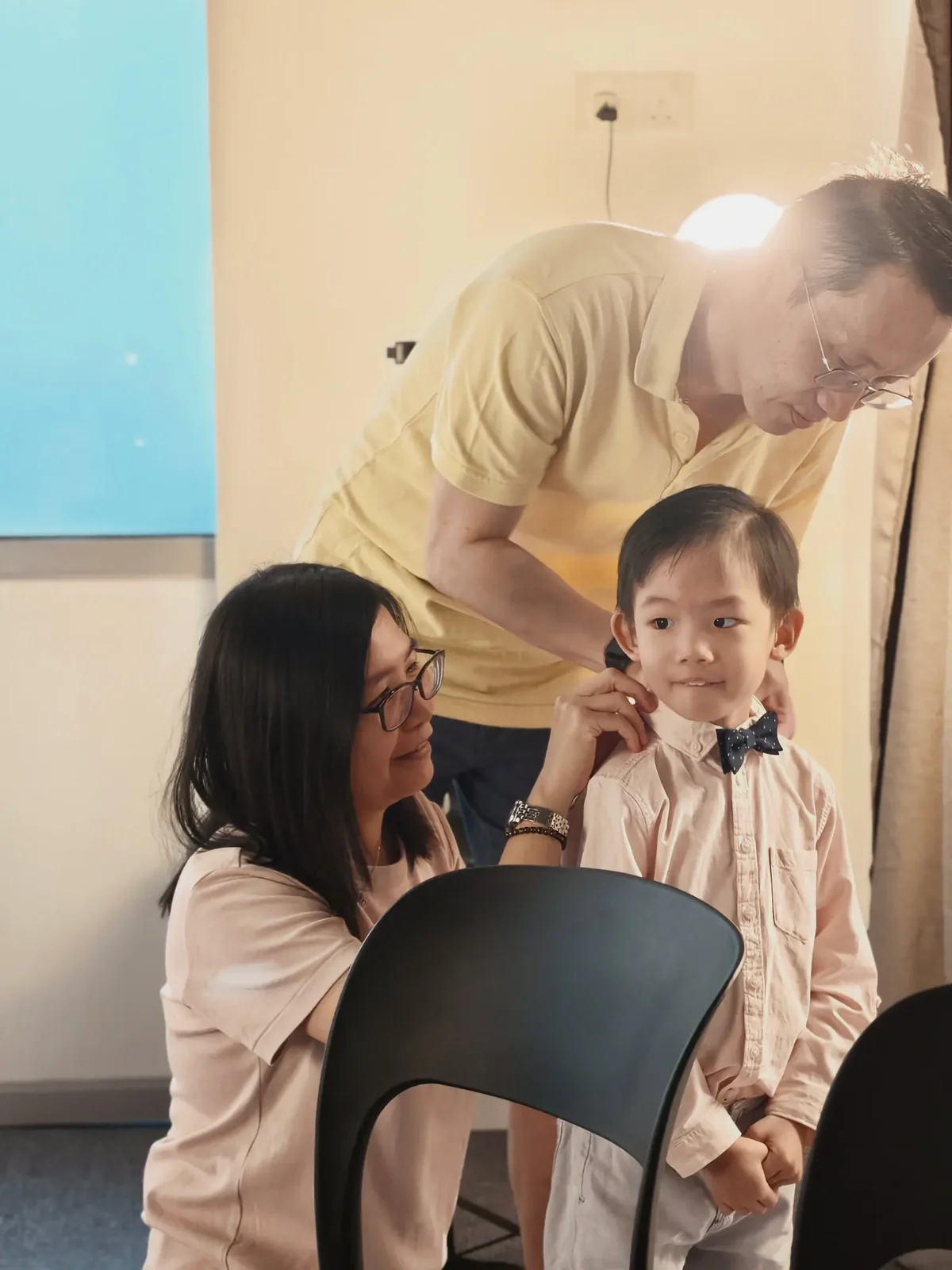 Family encouraging a young musician at the graduation performance