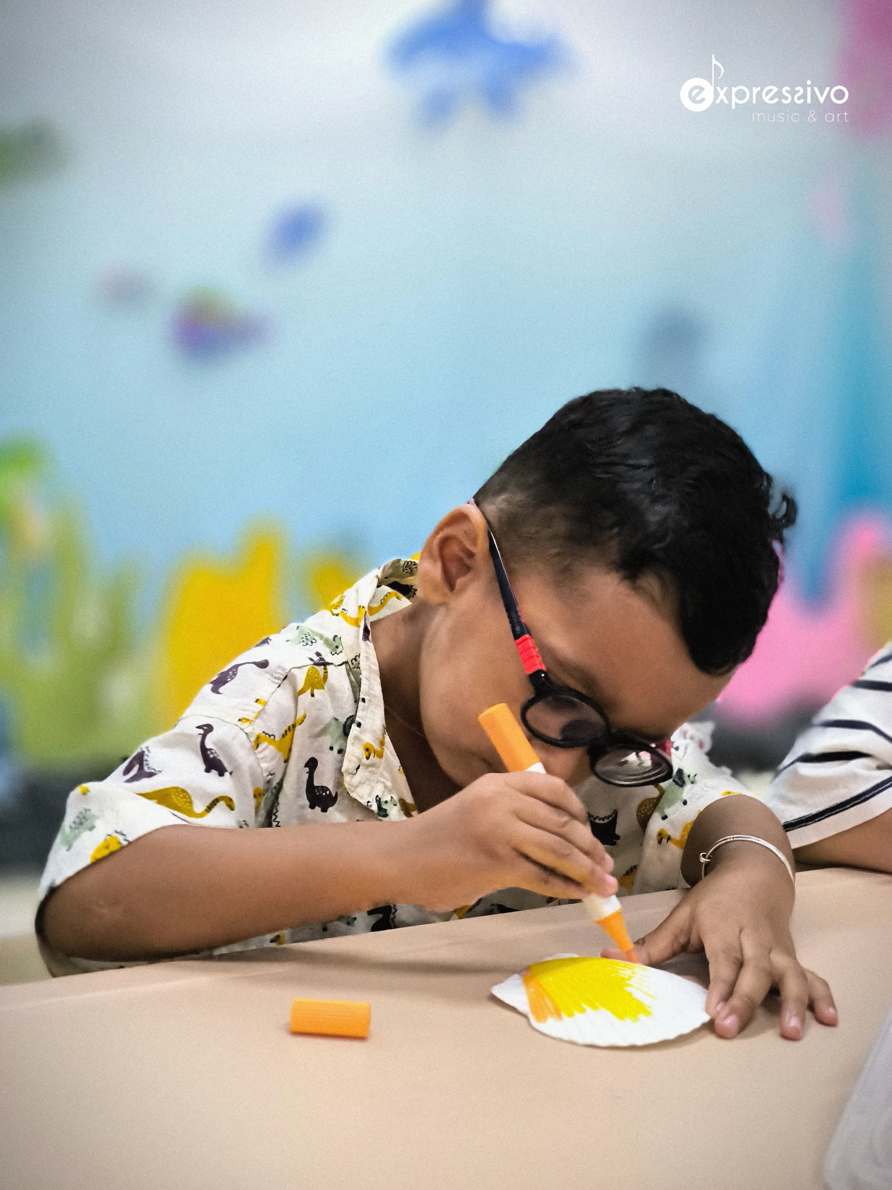 Child creating a bright beach-inspired art activity