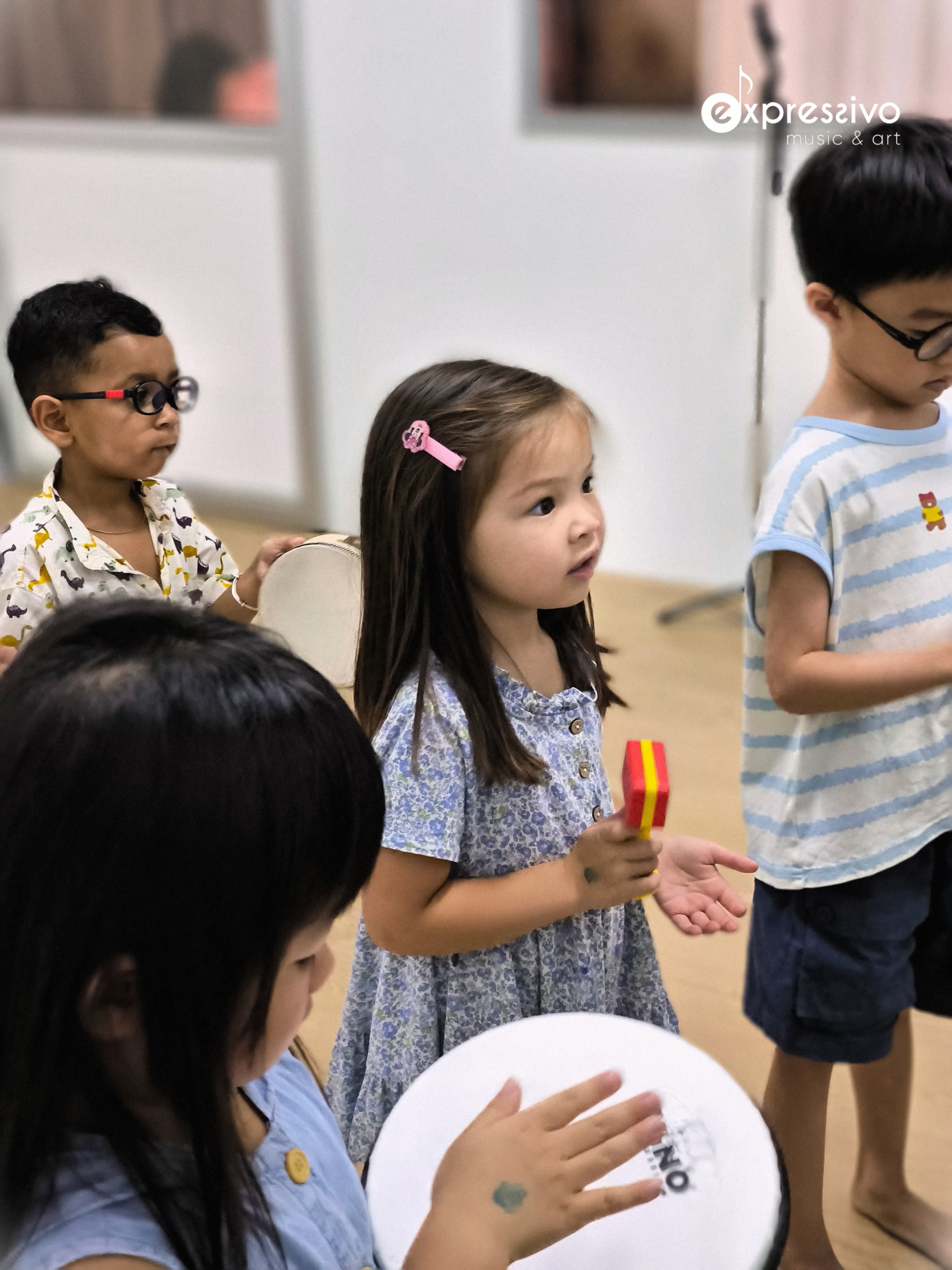 Young musicians playing percussion instruments together