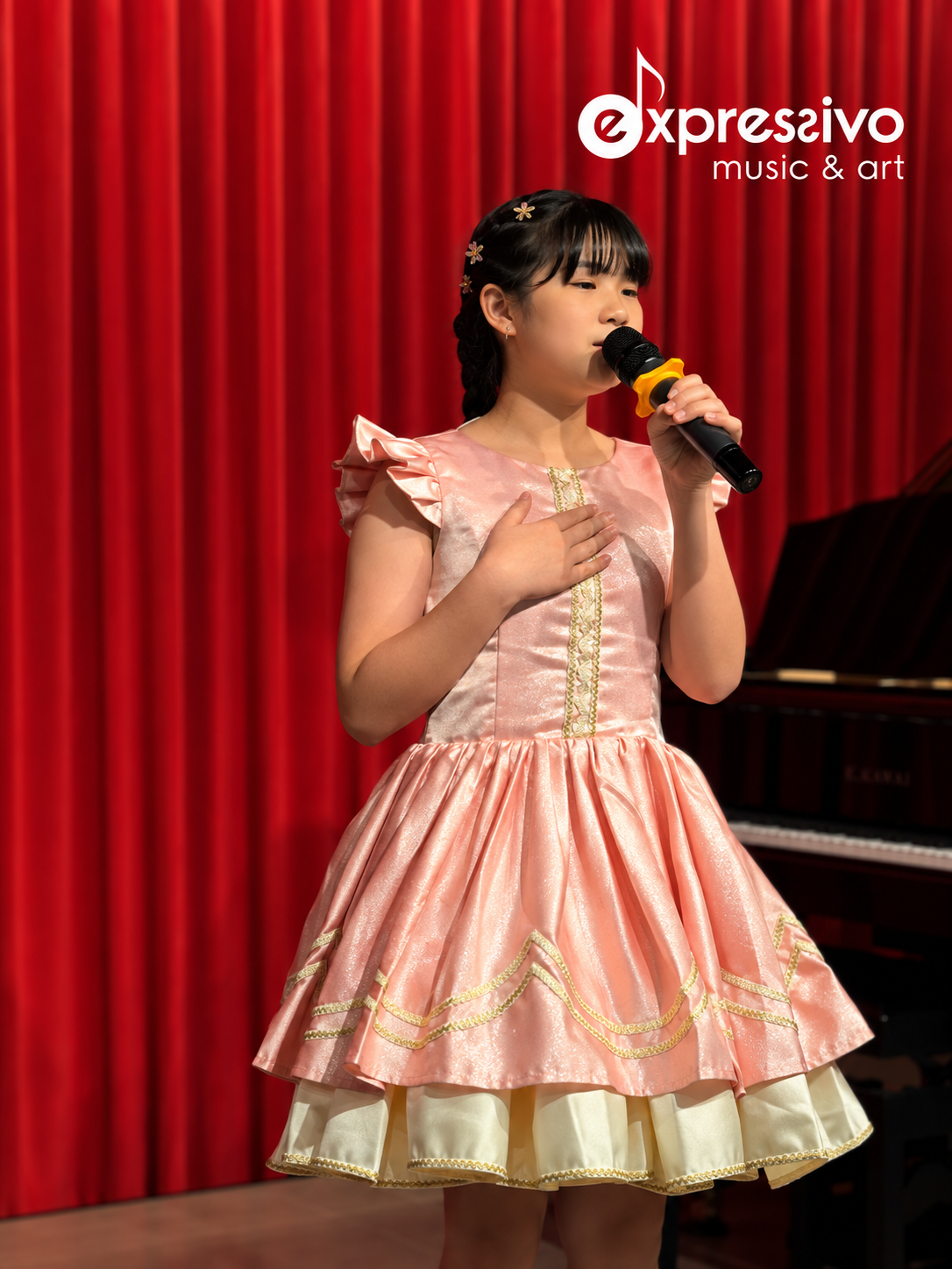 Young vocalist performing on stage at the Maestoso competition